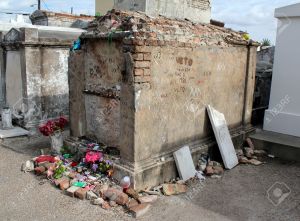 20552095-Tomb-of-unknown-Voodoo-practitioner-St-Louis-Cemetery-1-New-Orleans-Louisiana--Stock-Photo
